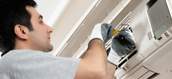 Technician repairing a ductless mini-split.